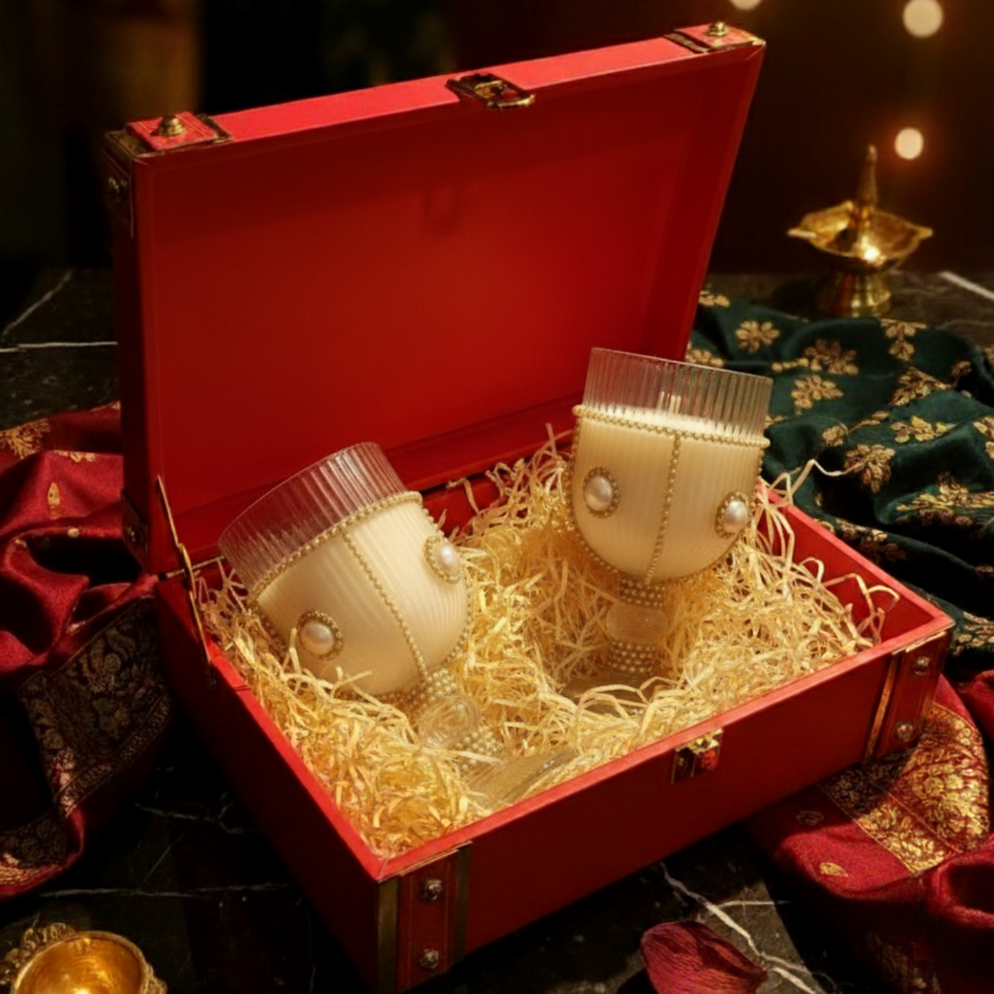 Two decorative items in a red box with gold interior