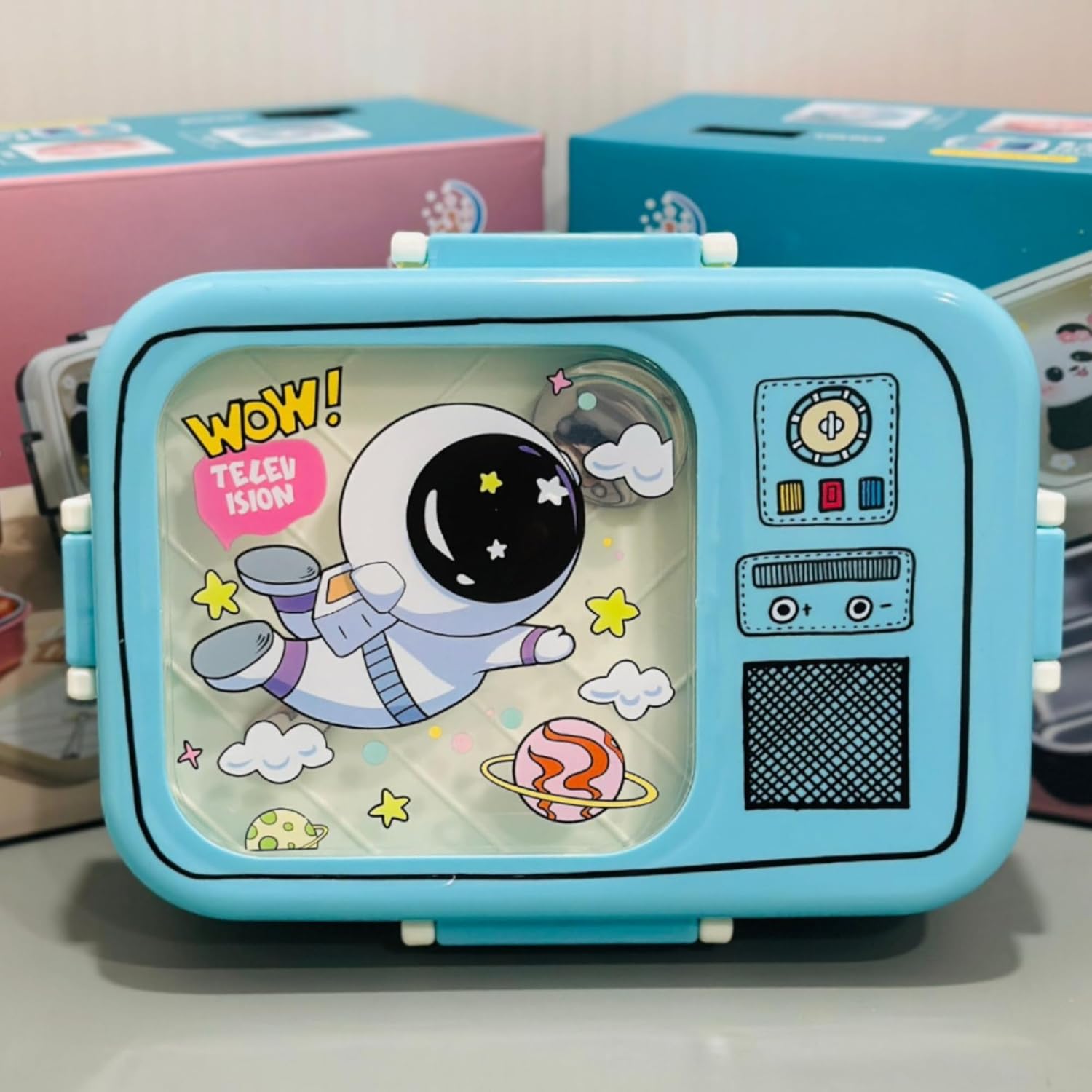 Toy television set with cartoon character on a white surface