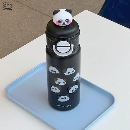 Black water bottle with panda design and panda-shaped lid on a blue tray