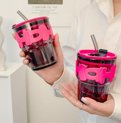 Two clear tumblers with pink