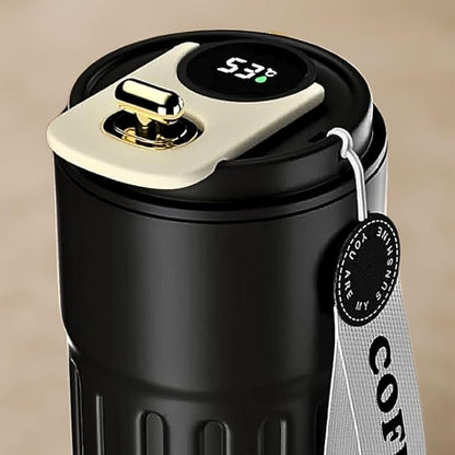 Black thermos with digital temperature display on a beige background