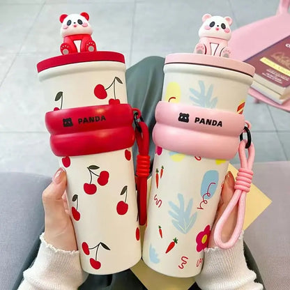 Two cartoon panda-themed cups with cherry designs on a neutral background
