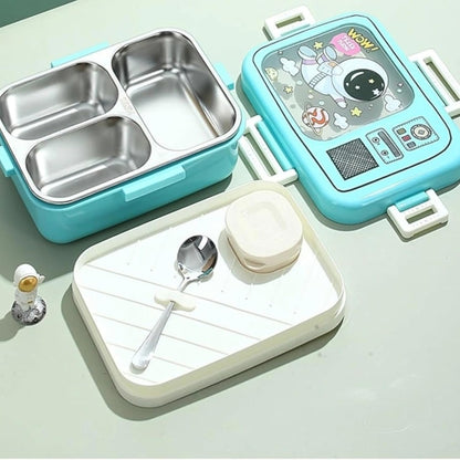 Children's lunch box set with compartments and a spoon on a light green background